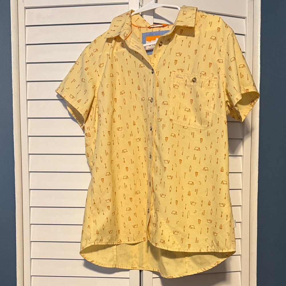 Orvis yellow and orange moon, tent, rod, paddle,canoe, fire pit and arrow shirt